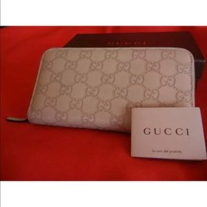 Gucci guccissima large embossed leather clutch